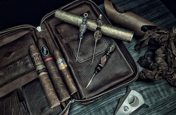 cigar accessories including cigar picks cigars and leather cigar case cigar tube and cutter