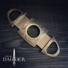 Load image into Gallery viewer, cigar cutter in antique brass with engraved design extended view