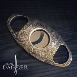 cigar cutter in antique brass with engraved design