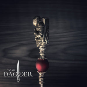 the red knight cigar saver with silver toned jewelry elements and beads close up