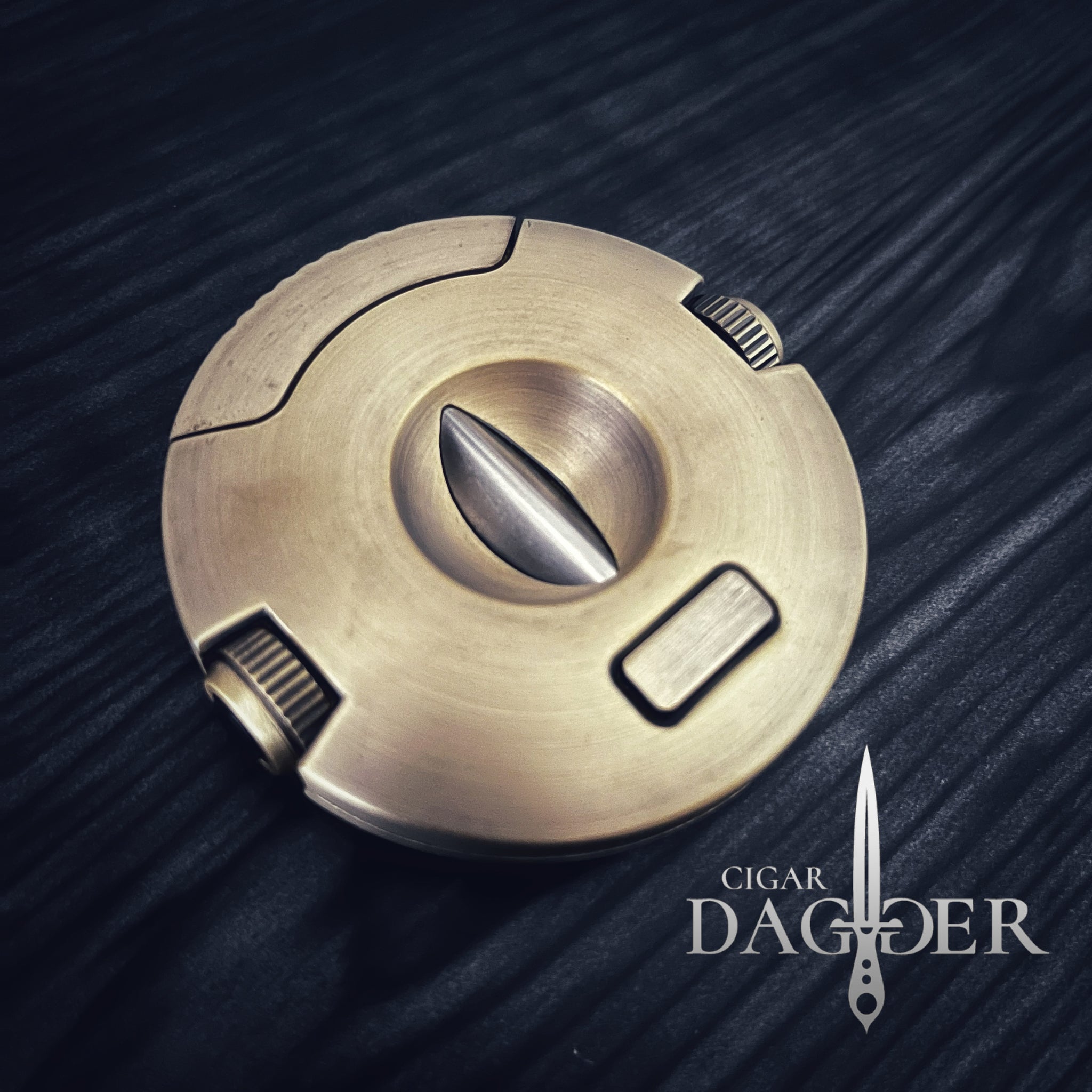 The Orbit V Cut Cigar Cutter With Punch in Brass – Cigar Dagger